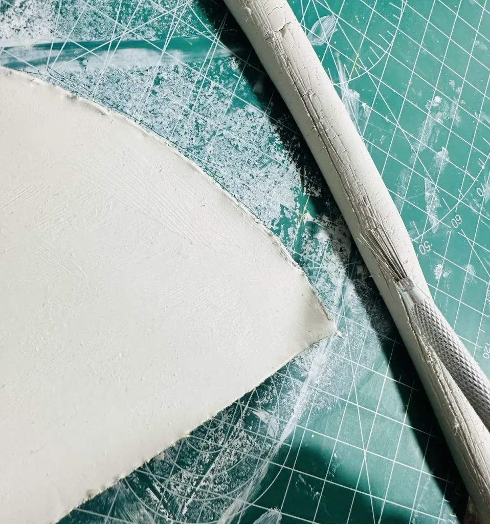 scoring the tray rim before attach