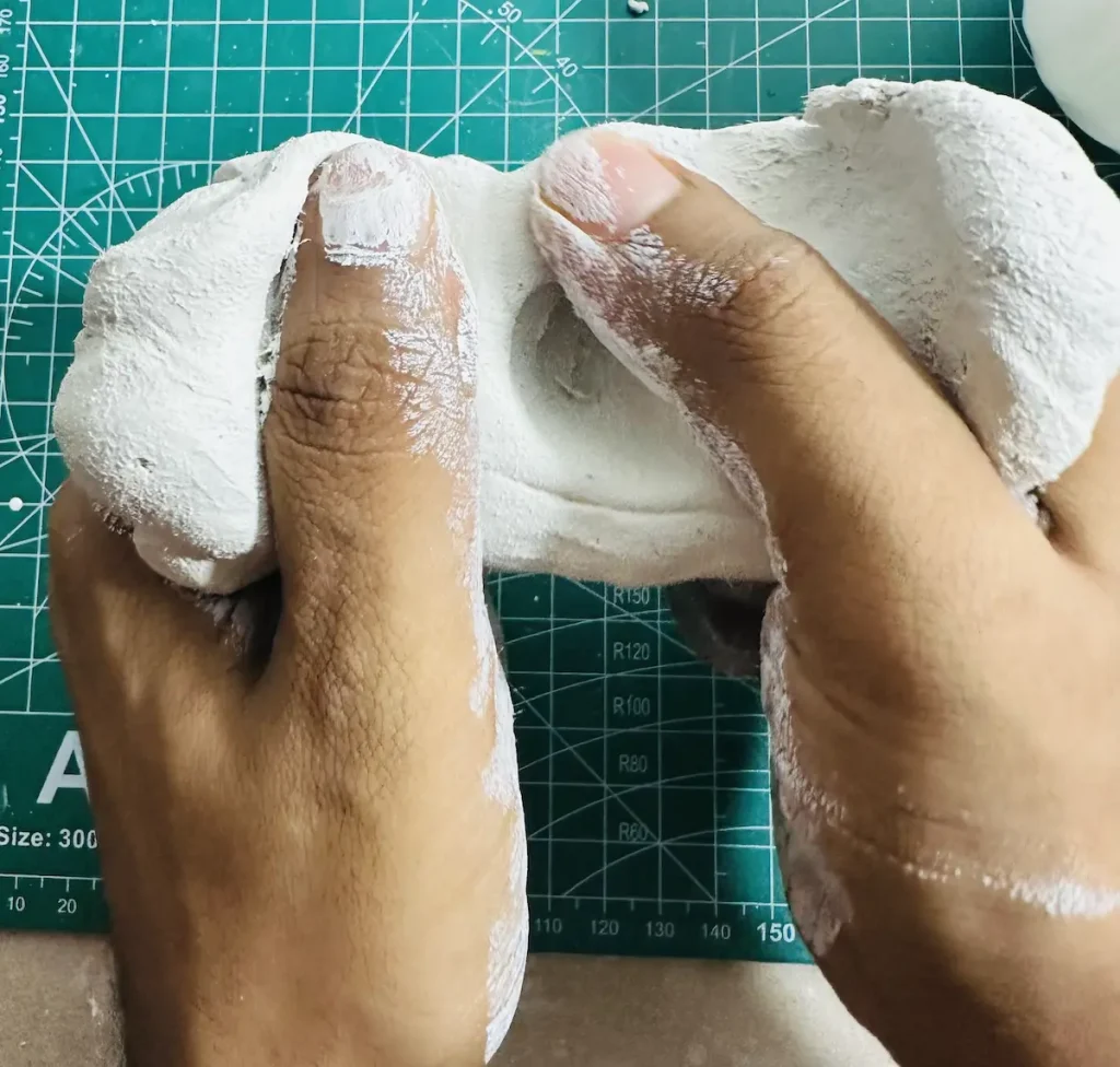 kneading the clay
