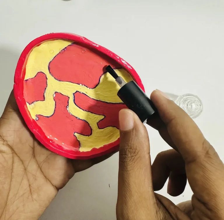 Applying nail polish to the trinket tray