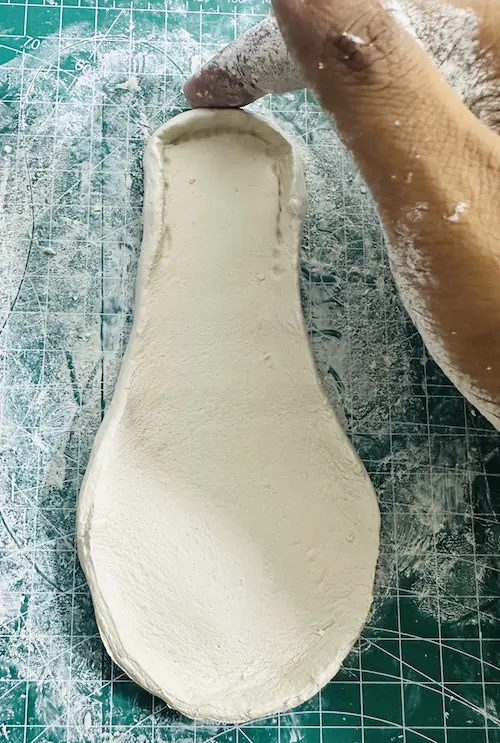 Smoothing papaya tray rim edges