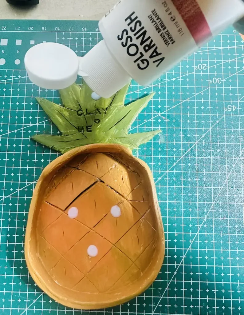 adding gloss varnish to the tray