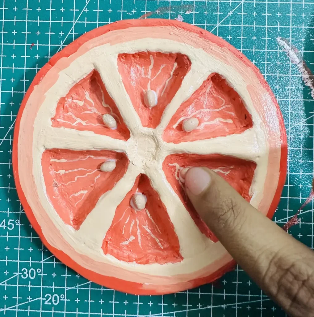 adding orange seeds