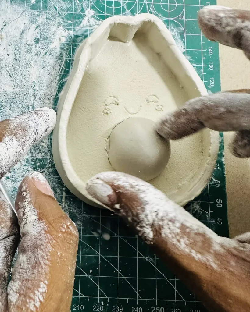 attaching the avocado pit to the base