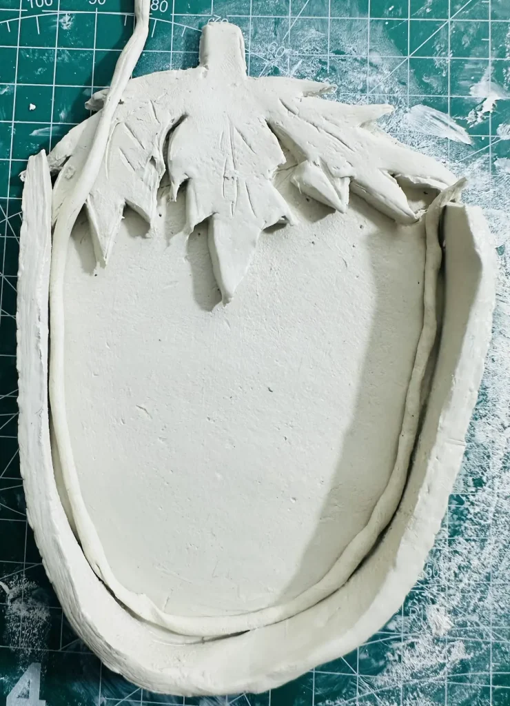 attaching the thin clay coil