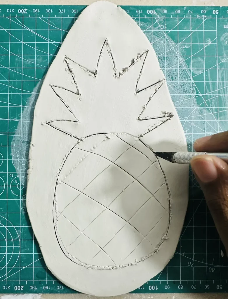 cutting the pineapple tray base