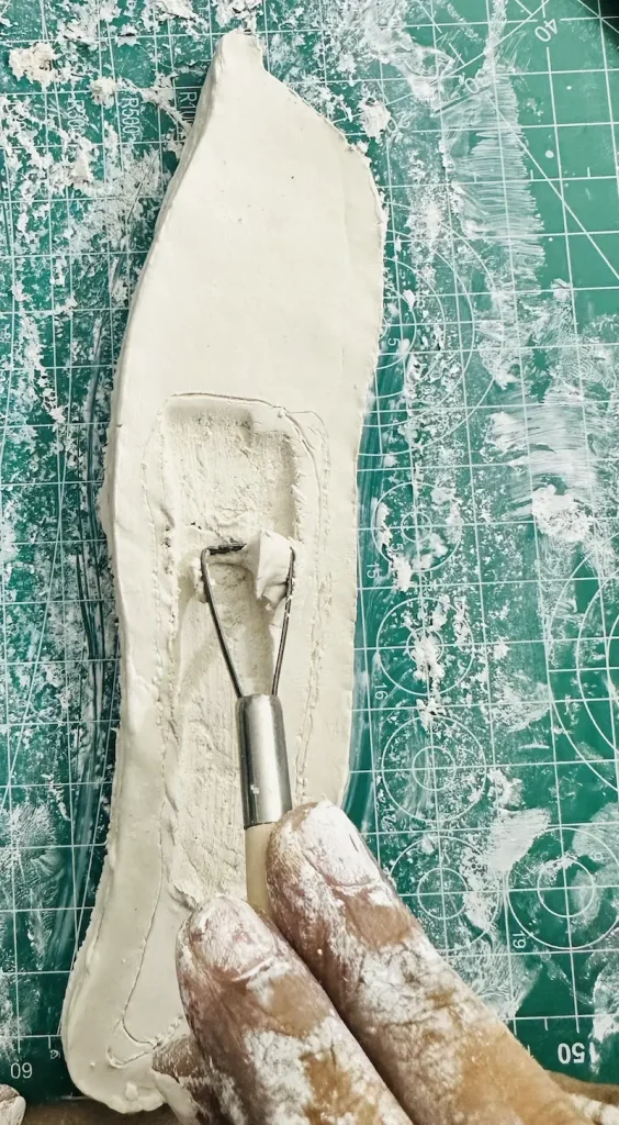 hollowing out the clay middle using the ribbon tool