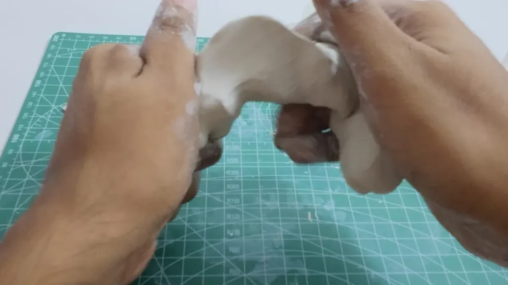 kneading air dry clay piece