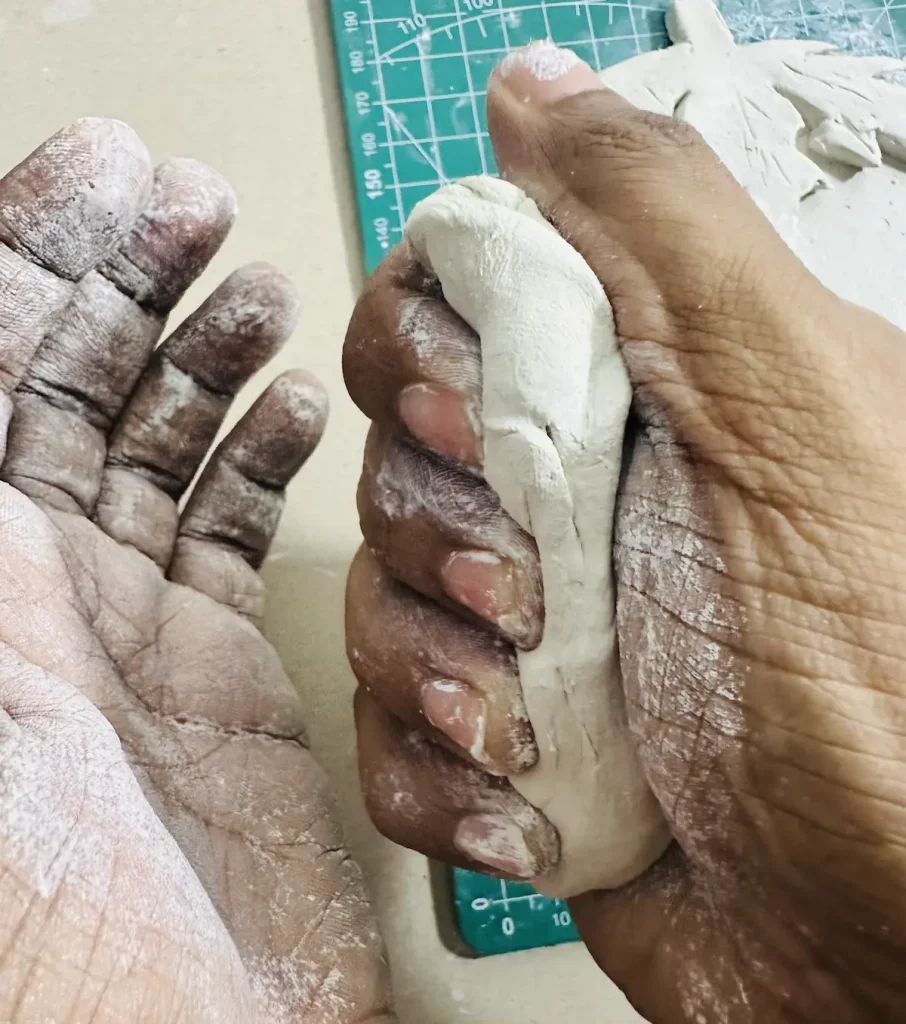kneading clay for tray rim