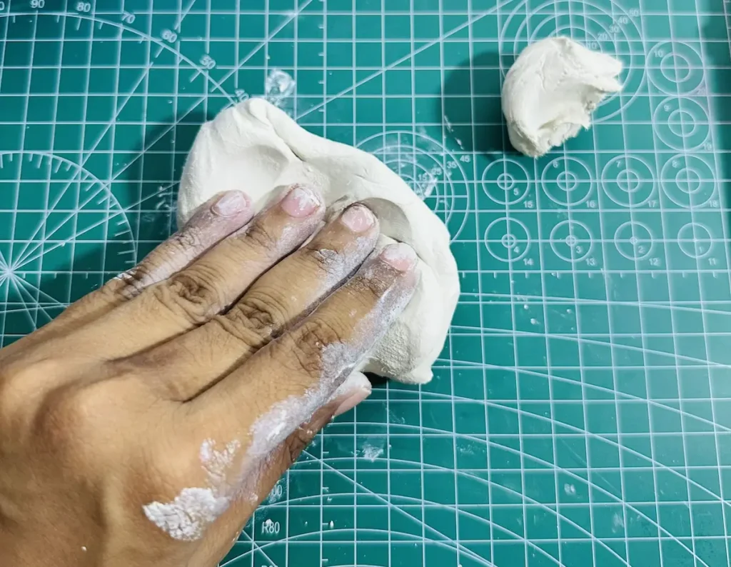 kneading the clay