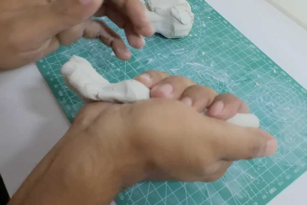 kneading the clay