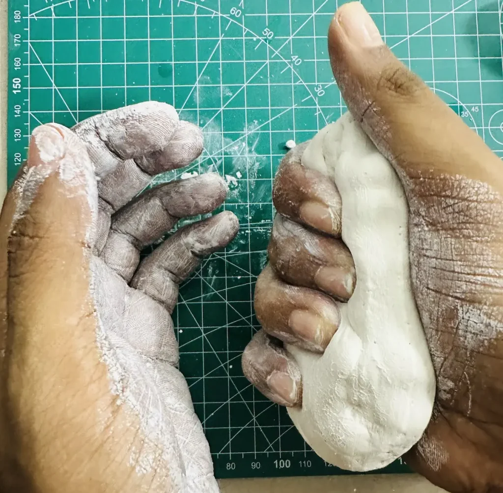 kneading the clay