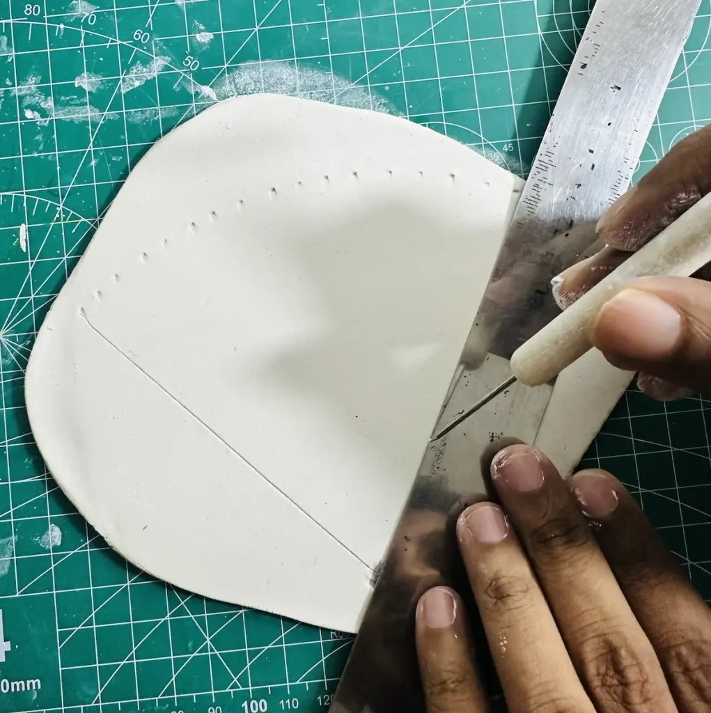 making geometric shapes with air dry clay using a ruler