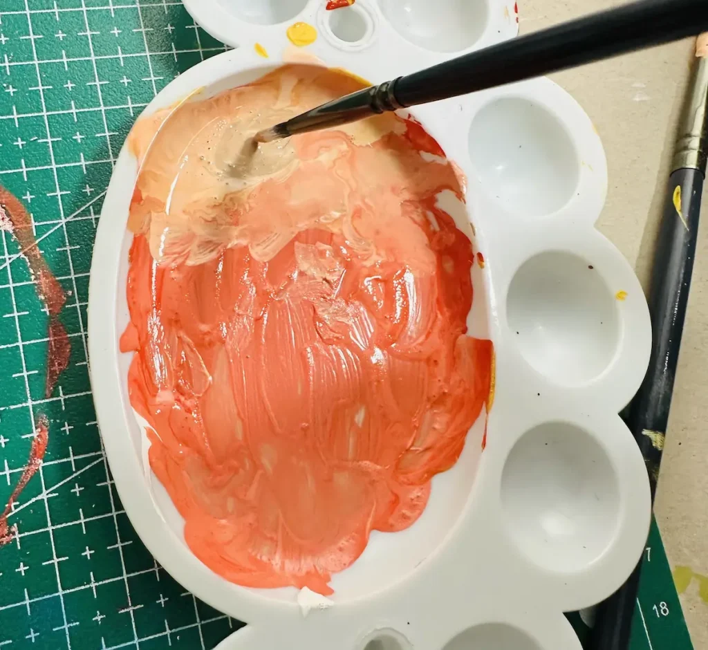 mixing acrylic for orange seeds
