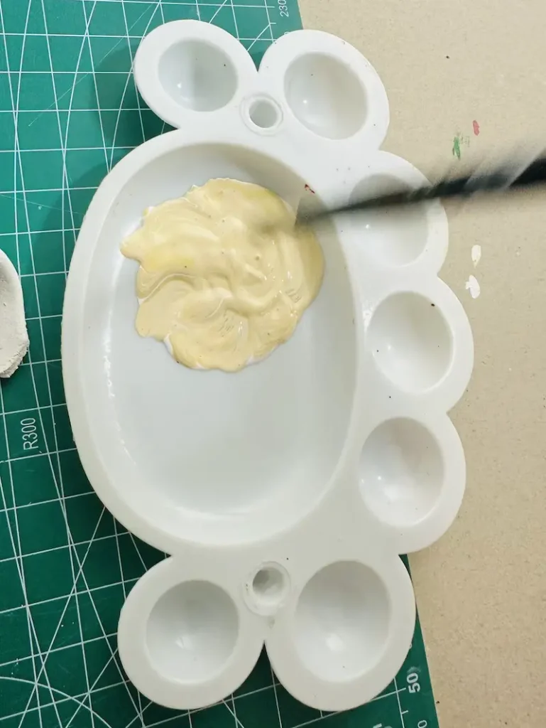 mixing colors to get the cream color for the banana flesh