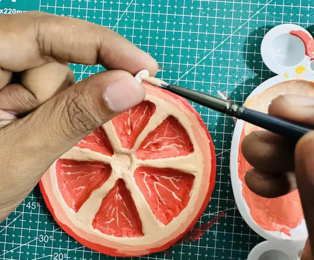 painting orange seeds
