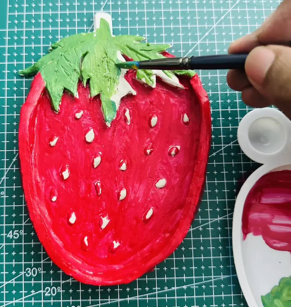 painting the strawberry leaves