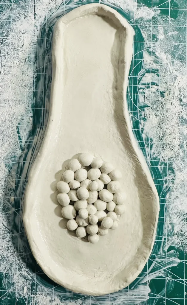 papaya tray base made with air dry clay before drying
