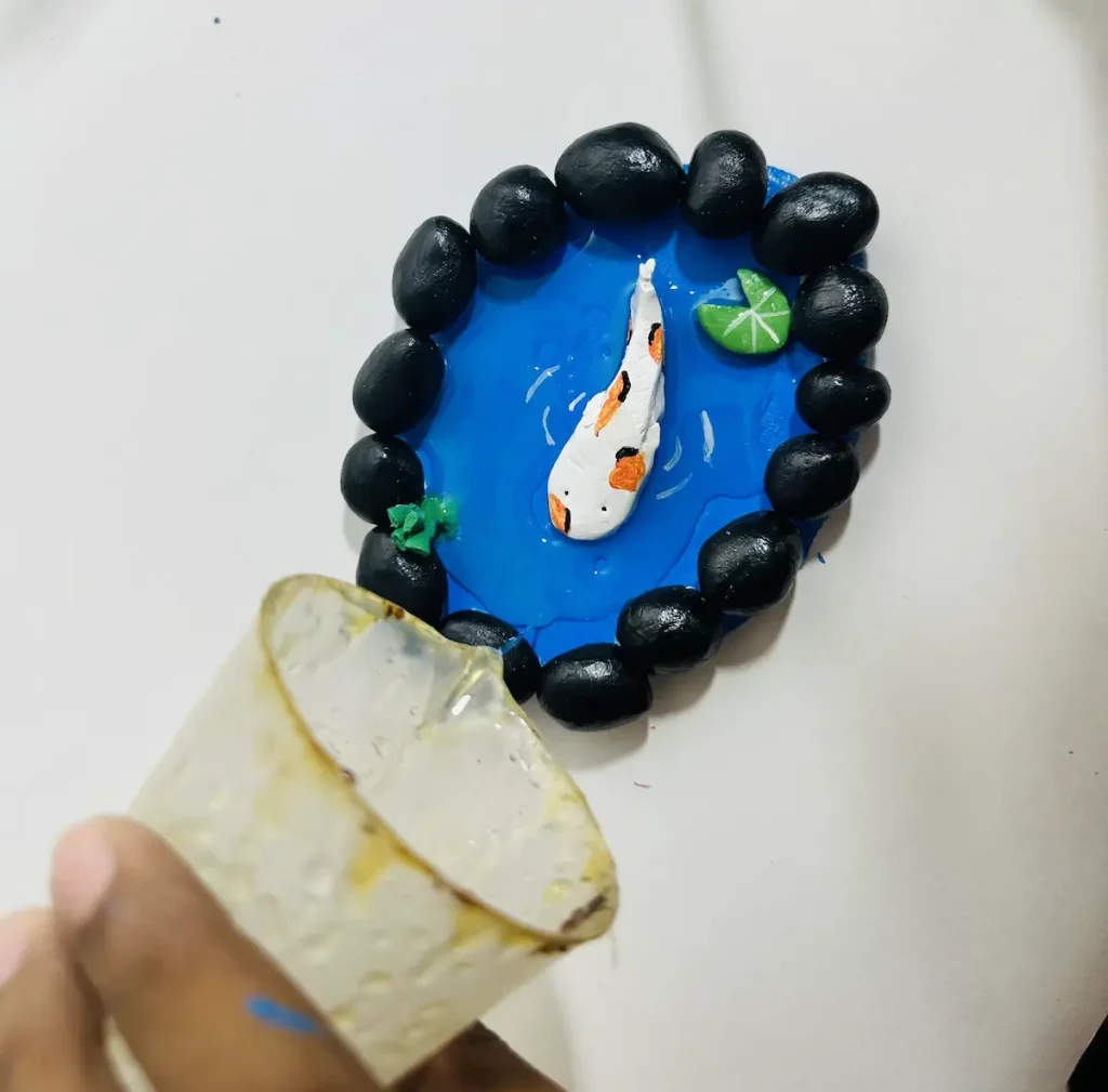 pouring epoxy resin on to air dry clay project