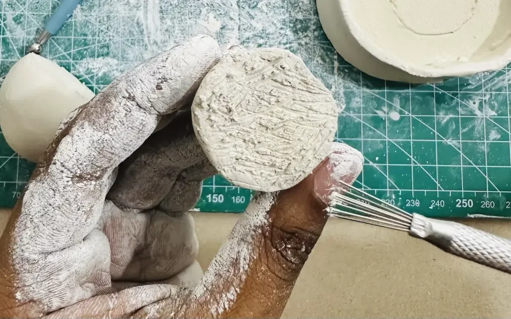 scoring the bottom of the avocado pit