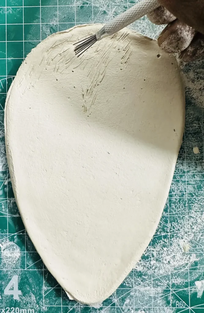scoring the tray base