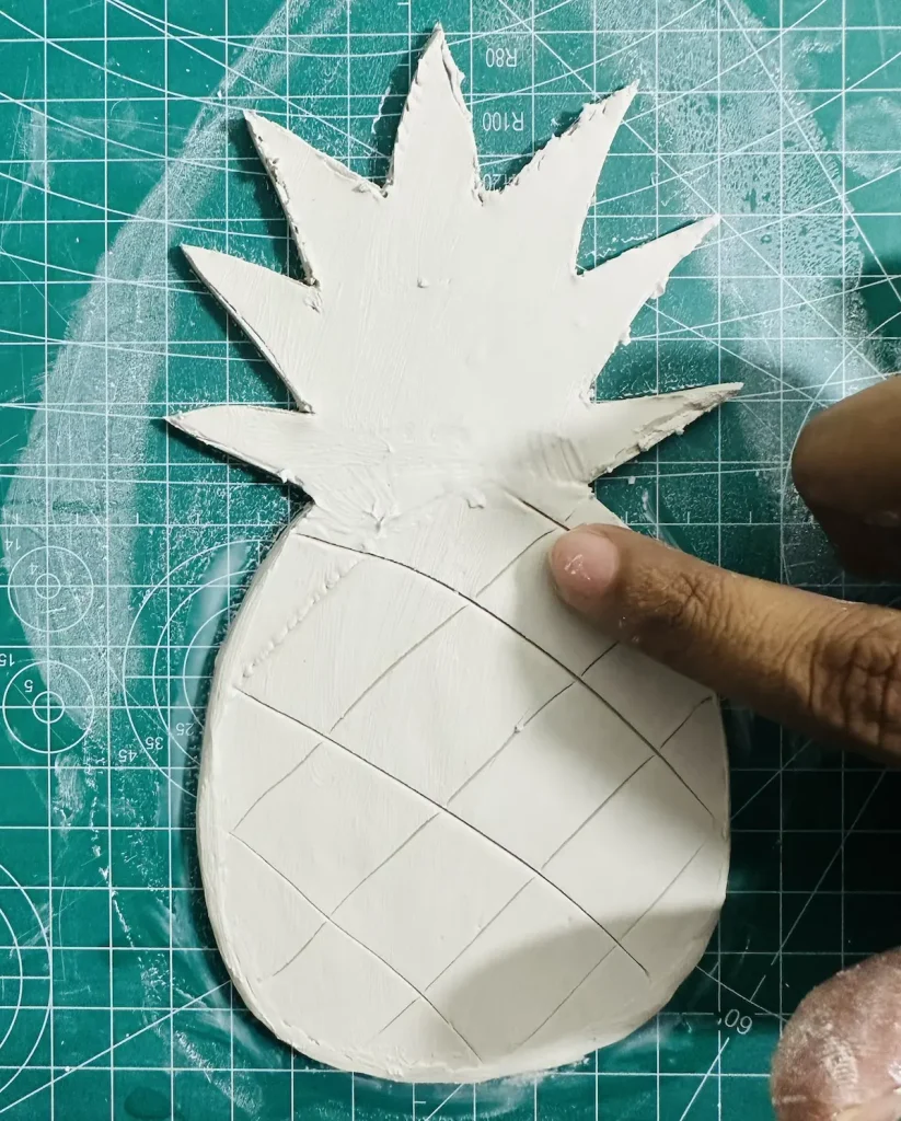 smoothing out the pineapple tray base