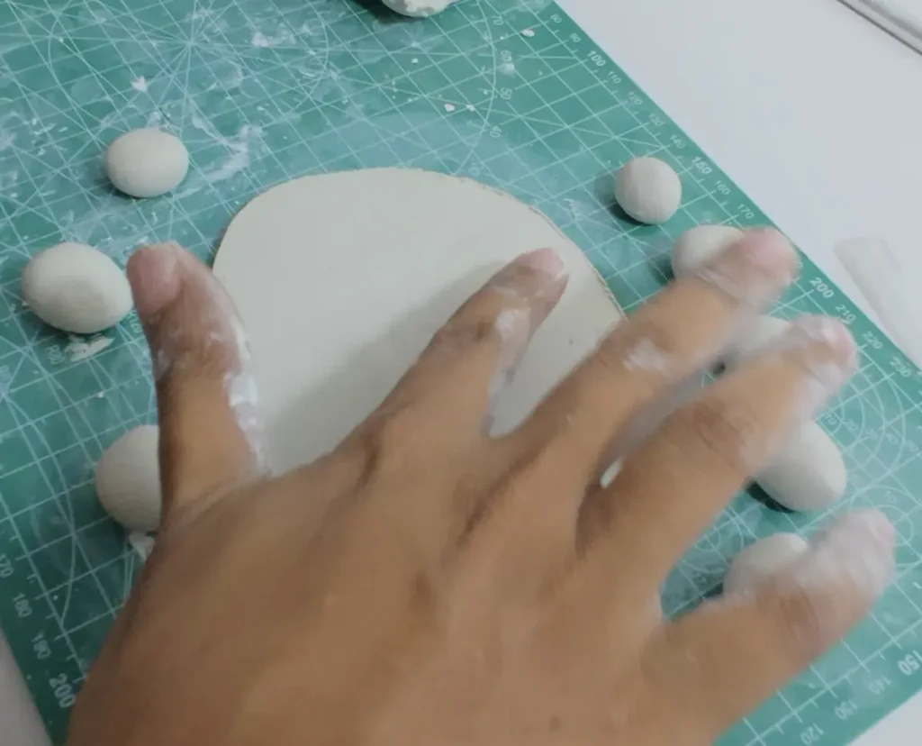 smoothing pond base surface with water