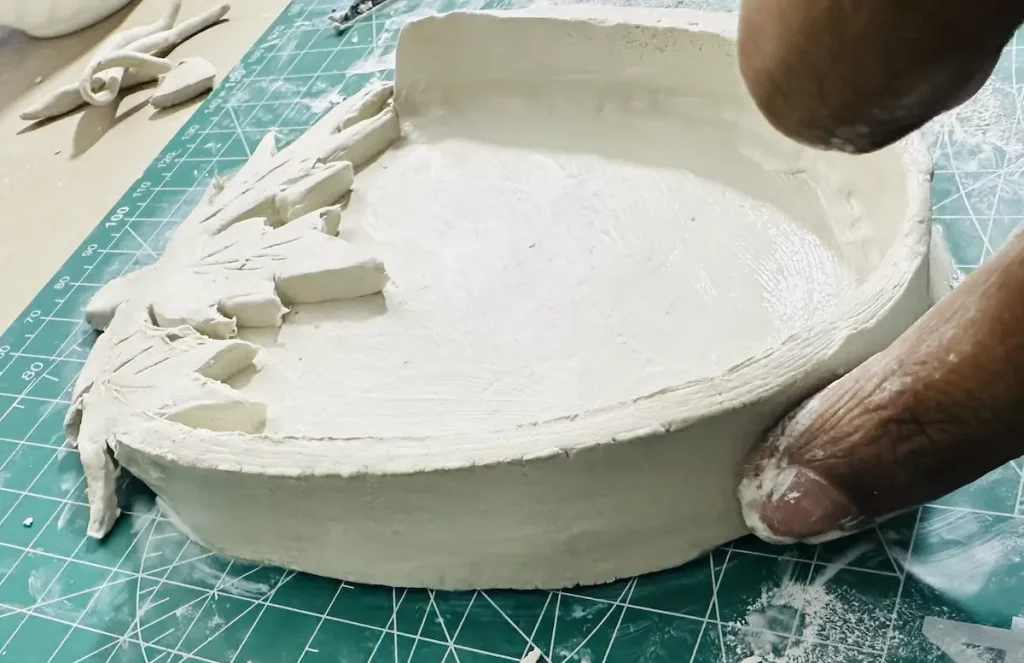 smoothing the tray rim