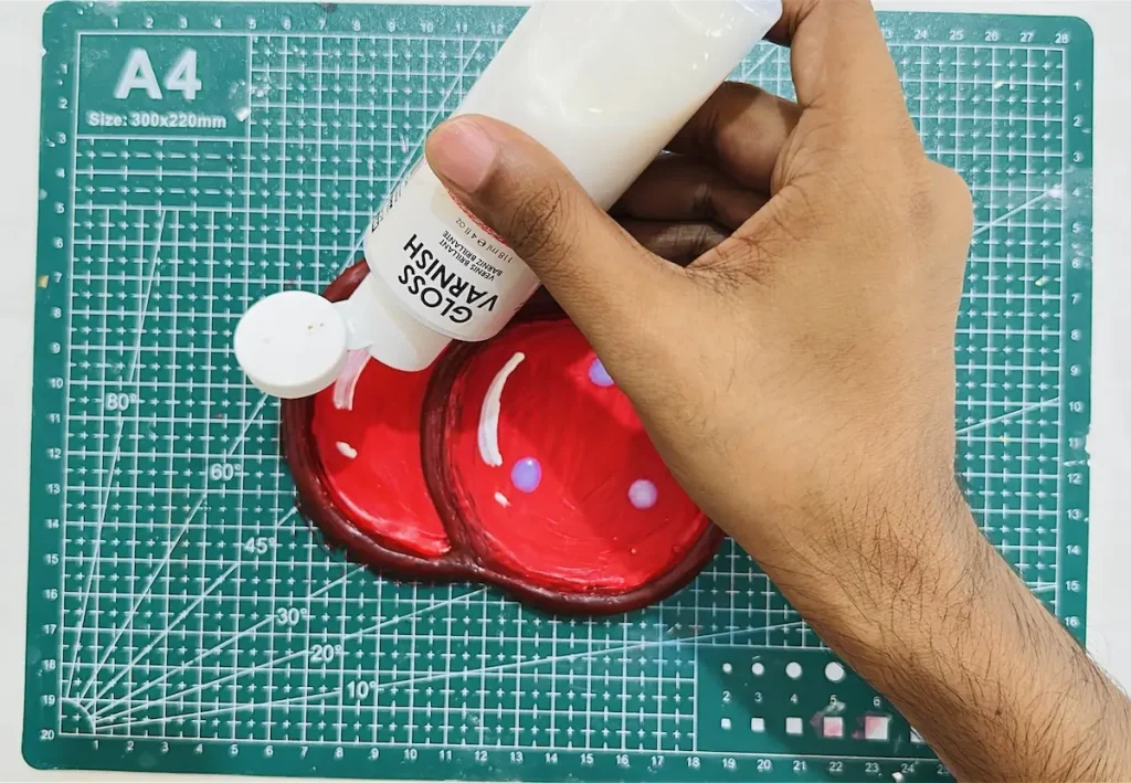 adding gloss varnish on cherry trinket tray