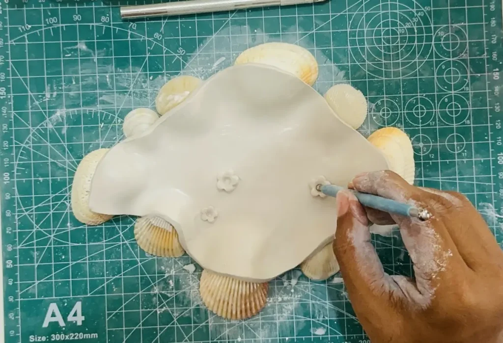 attaching the clay flowers