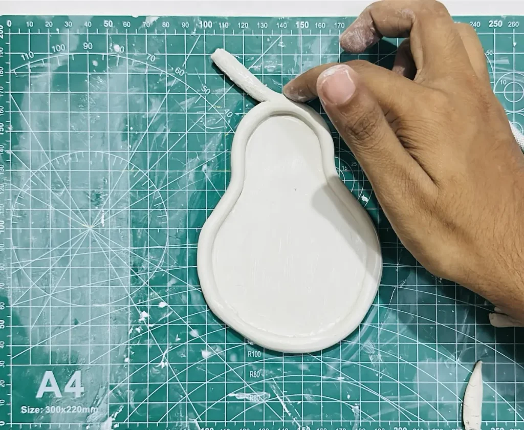attaching the stem to the pear tray