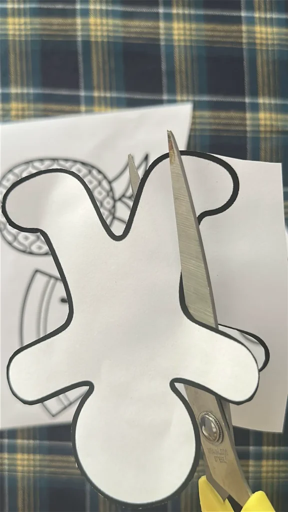 cutting the gingerbread man shape