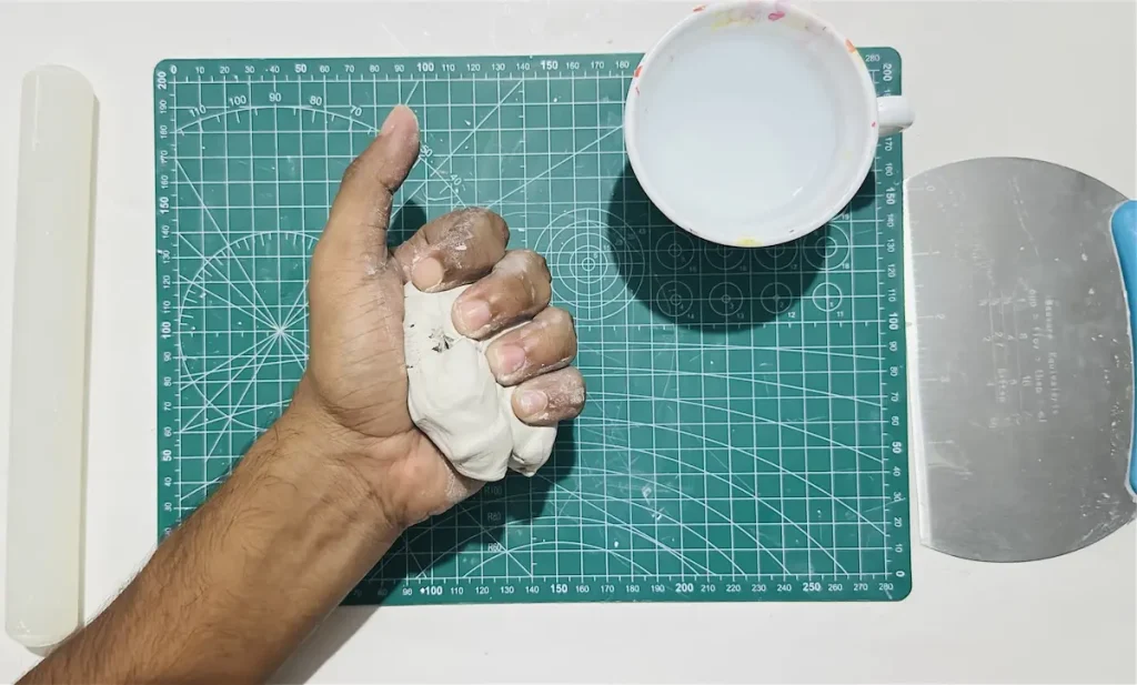 kneading the clay
