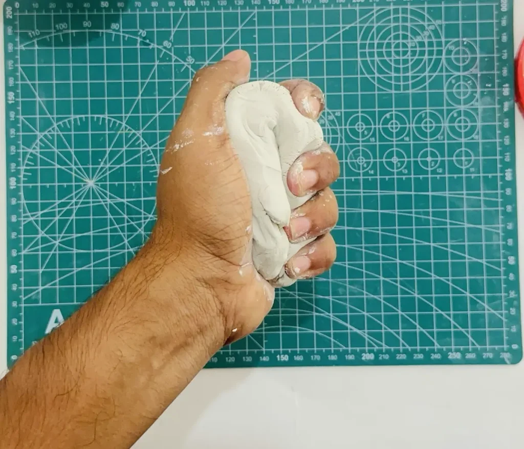 kneading the clay