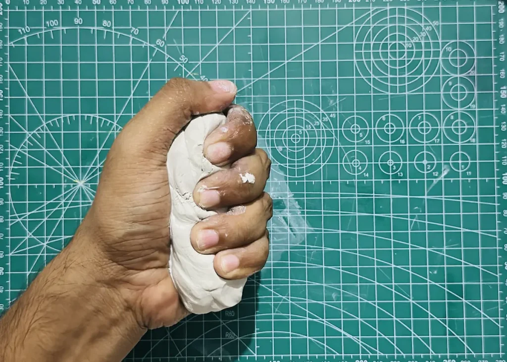 kneading the clay