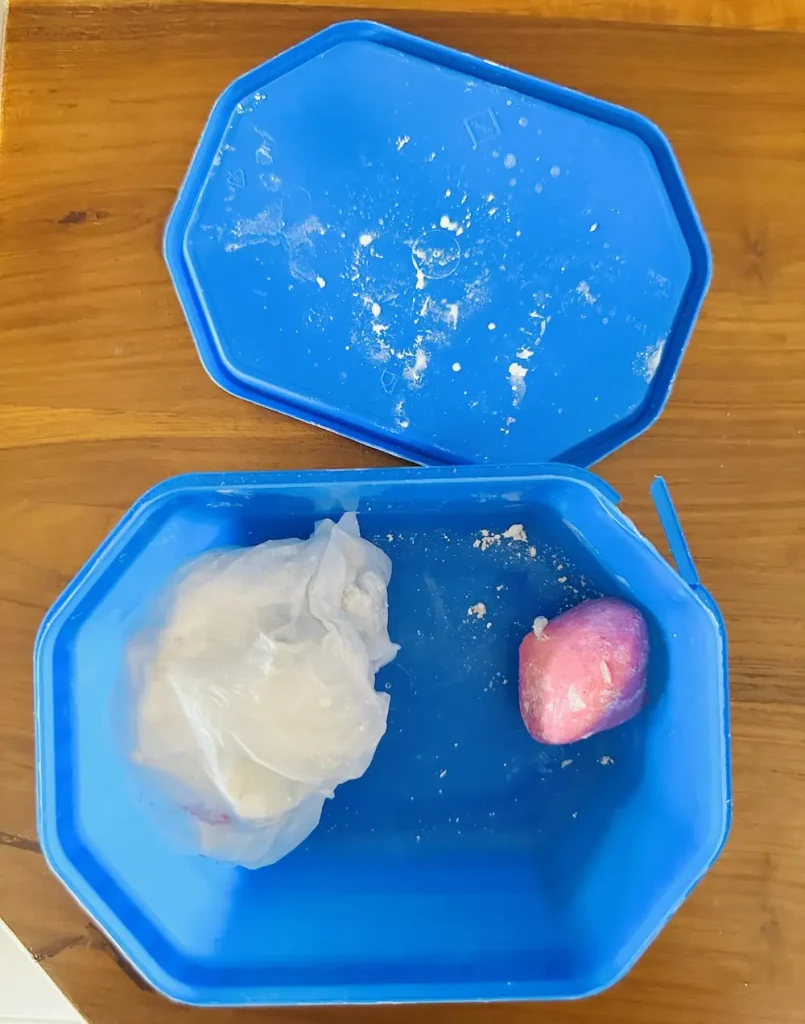 leftover air dry clay in a airtight plastic container