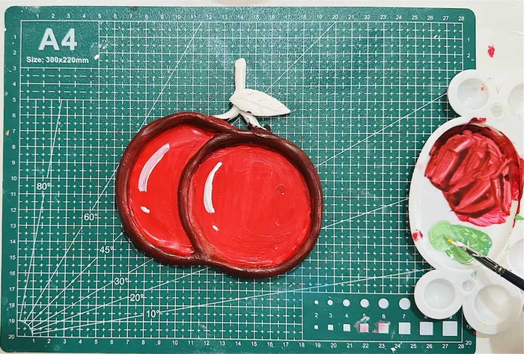 mixing acrylic paints for the leaf and the stem