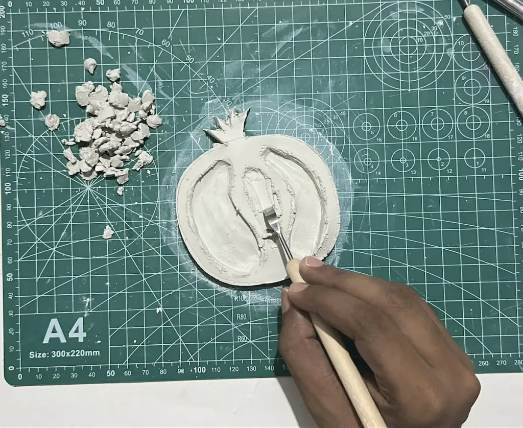 scooping out the clay to make chambers and walls