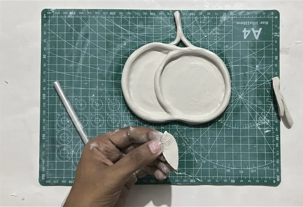 scoring the bottom of the cherry leaf