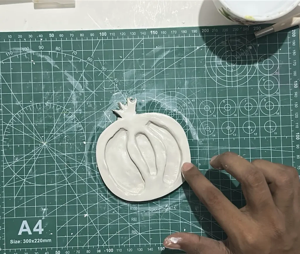smoothing out the pomegranate tray