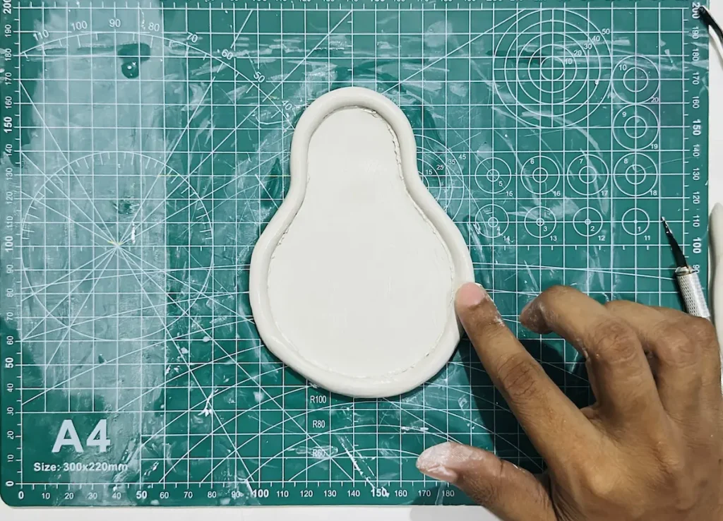 smoothing out the tray rim