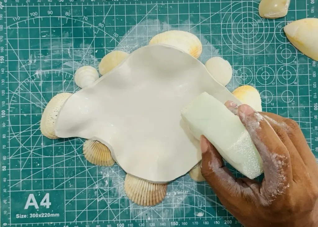 smoothing the dish base