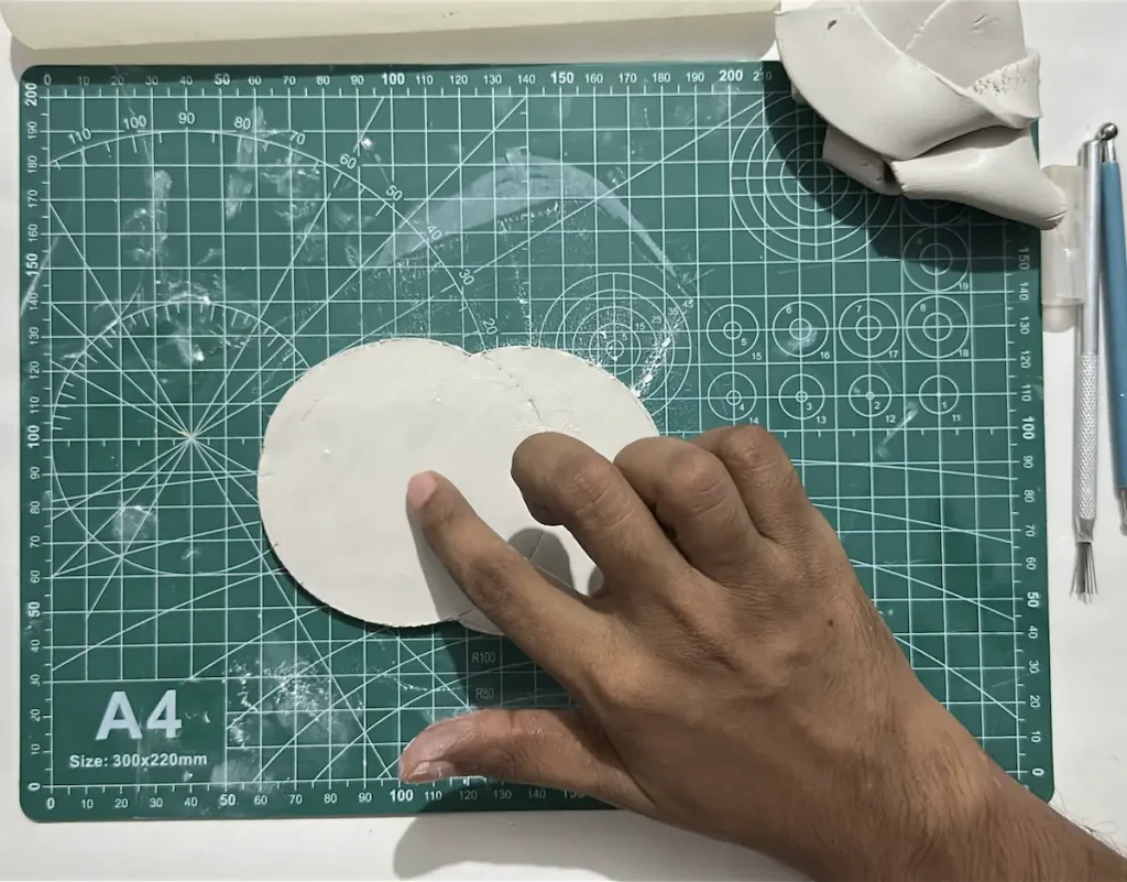 smoothing the surface of clay slab