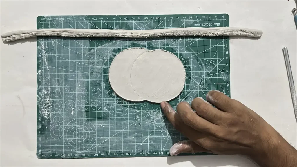 tapping a little bit of water over the scored area of tray base