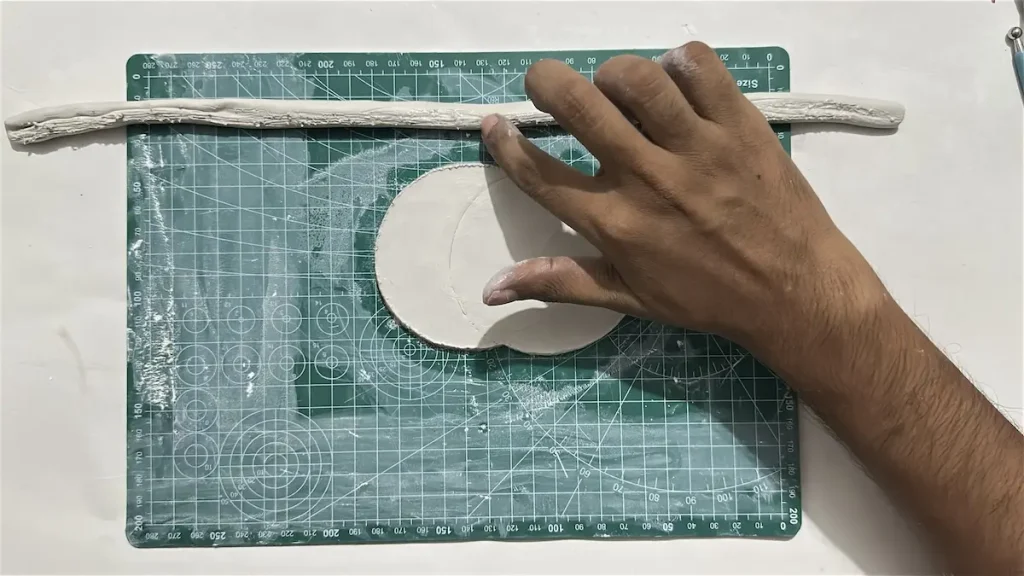 tapping water over the scored area of tray rim