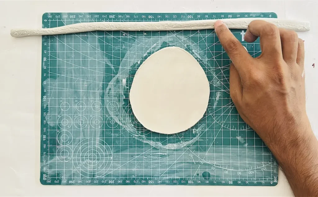 tapping water over the scored tray base surface