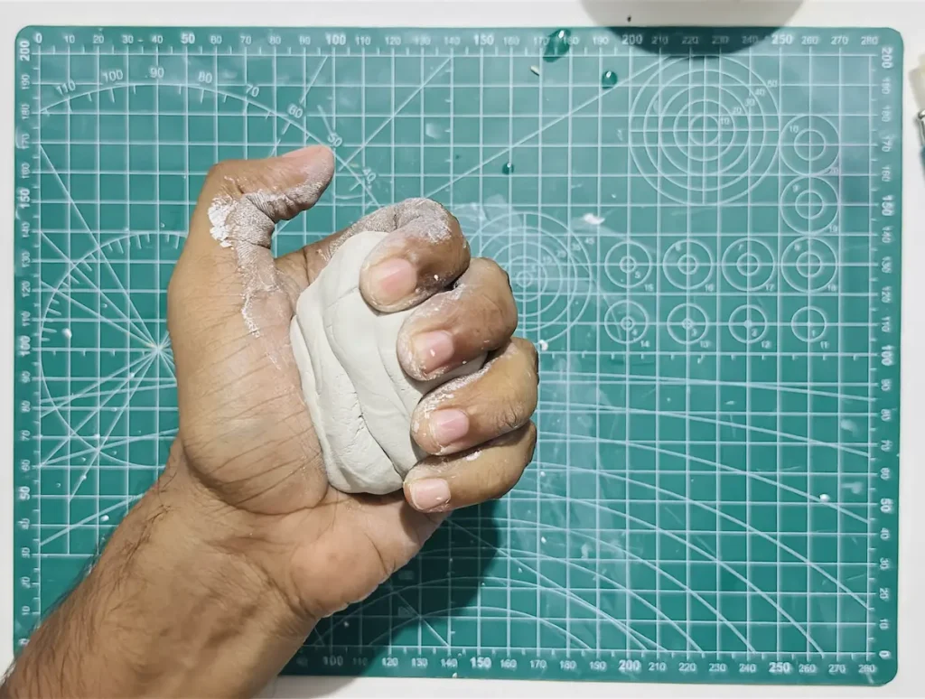 kneading the clay