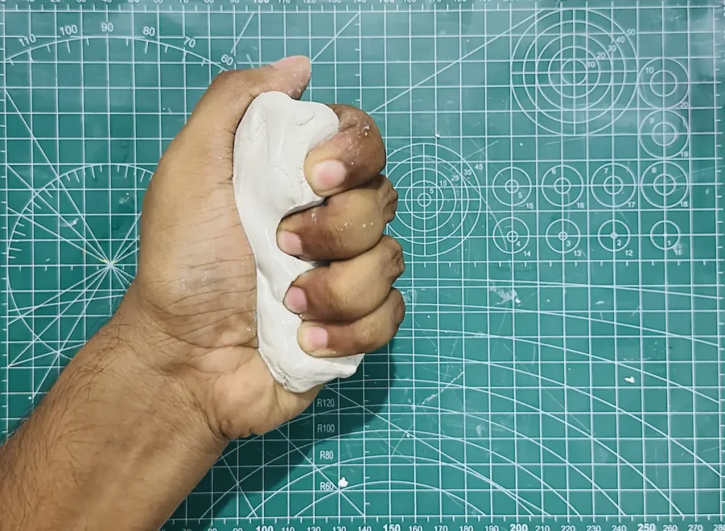 kneading the clay