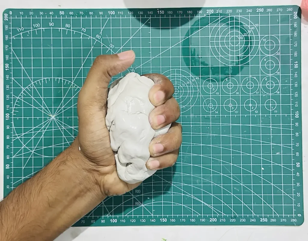 kneading the clay