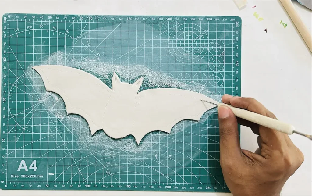mapping the outlines before hollowing out the clay
