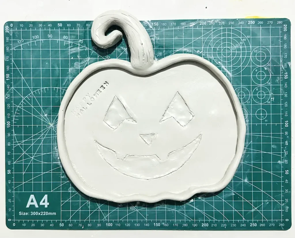 pumpkin tray made with air dry clay before drying